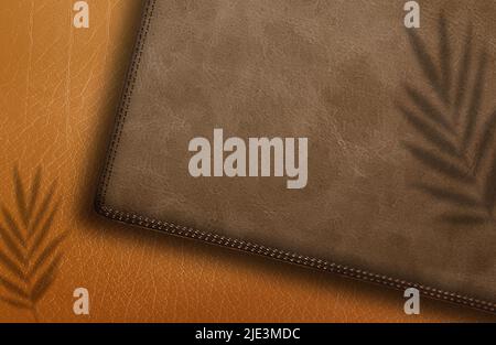 Logo-Mockup auf Leder-Geldbörse in Braun auf braunem Hintergrund mit Schatten Stockfoto