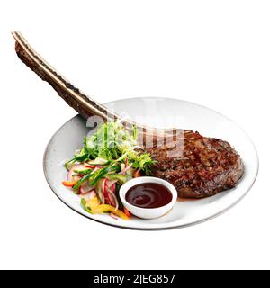 Isolierte Portion gegrilltes Rindfleisch Tomahawk Steak Stockfoto