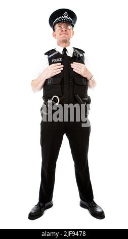 Ein britischer uniformierte Polizist alarmiert und bereitet sich auf den Dienst vor. Teil einer Serie von Bildern mit demselben Zeichenmodell. Stockfoto