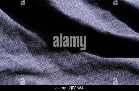 Hintergrund mit blauer Stofftextur in Nahaufnahme Stockfoto