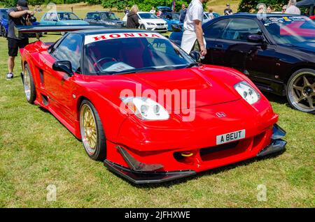 Vorderansicht eines roten Honda NSX-Sportwagens aus dem Jahr 1992 auf der Motorshow in Reading, Großbritannien Stockfoto