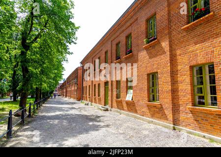 Alte Textilfabriken in Księży Młyn konvergierten jetzt zu Wohn- und Büroflächen, Lodz, Polen Stockfoto