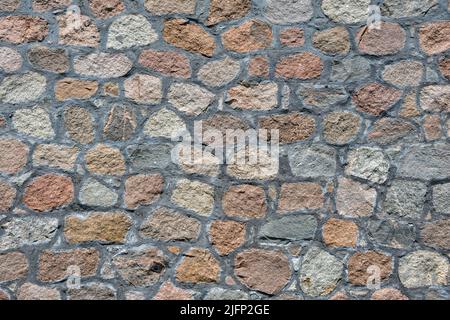 Textur einer alten Steinmauer. Steinwall Hintergrund. Stockfoto