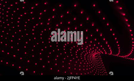 Gebogene 3D Linien von Punkten bewegen sich auf schwarzem Hintergrund. Design. Punkte bewegen sich im gekrümmten Volumenstrom. Punktfluss mit 3D Effektkurven und geometrischen Kurven im Dunkeln Stockfoto