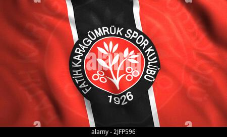 Logo des türkischen Fußballclubs. Bewegung. 3D Hintergrund der wehenden Flagge mit Emblem des türkischen Fußballvereins. Der türkische Fußballverein Fatih Karagyumryuk Stockfoto