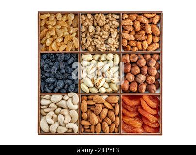 Sammlung von verschiedenen Nüssen und getrockneten Früchten. Verschiedene Nüsse Mandeln, Pistazien, Cashews, Walnuss. Verschiedene getrocknete Früchte, Nüsse und Samen, Draufsicht. Gesund Stockfoto