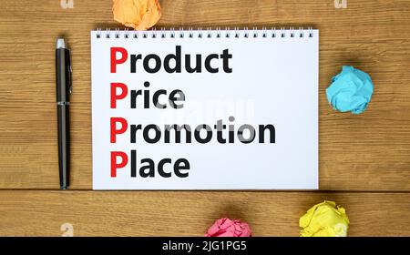 PPPP Produkt Preis Promotion Ort Symbol. Konzept Worte PPPP Produkt Preisförderung auf der Notiz auf schönen Holzhintergrund. Business und P Stockfoto