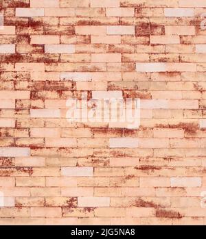Verwitterte, lackierte Ziegelwand Stockfoto
