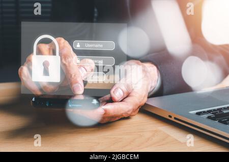 Man Hand tippen auf der Tastatur mit Login und Passwort auf dem Bildschirm, Cyber-Security-Konzept, Datenschutz und gesicherten Internetzugang. Stockfoto