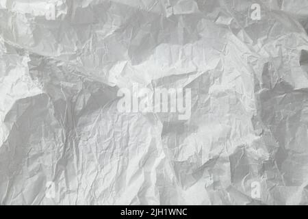Zerknittertes weißes Transparentpapier. Stockfoto