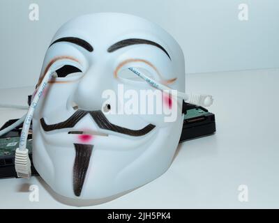 Guy Fawkes mögen Hacker-Maske im anonymen Stil. Hervorragende Bilder für Anwendungen im Bereich Cybersicherheit. Stockfoto