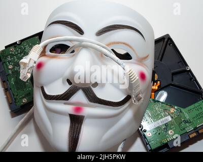 Guy Fawkes mögen Hacker-Maske im anonymen Stil. Hervorragende Bilder für Anwendungen im Bereich Cybersicherheit. Stockfoto