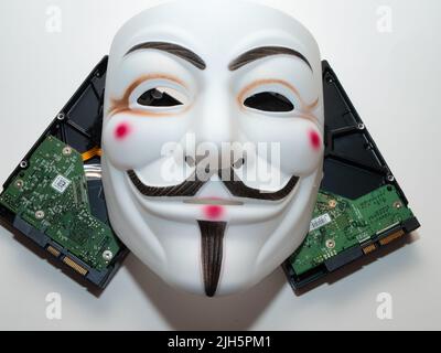 Guy Fawkes mögen Hacker-Maske im anonymen Stil. Hervorragende Bilder für Anwendungen im Bereich Cybersicherheit. Stockfoto