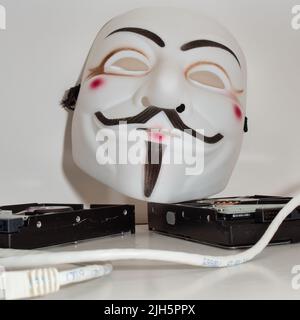 Guy Fawkes mögen Hacker-Maske im anonymen Stil. Hervorragende Bilder für Anwendungen im Bereich Cybersicherheit. Stockfoto