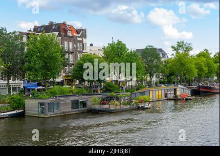 House Boats on the River Amstel, Amsterdam, Niederlande Stockfoto