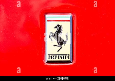 Close up of a Ferrari badge on a red Ferrari Stockfoto