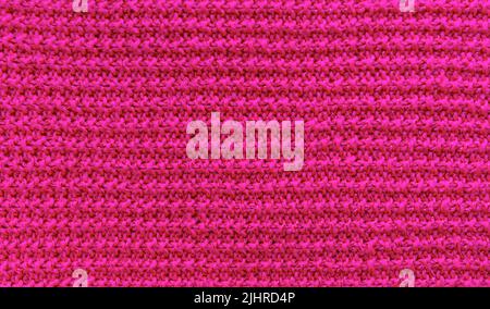 Struktur aus gestricktem Stoff mit Lurex-Faden. Stockfoto
