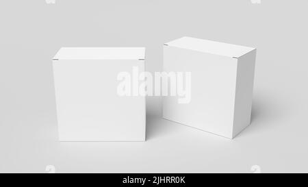 Zwei quadratische Kisten sind nachgeahmt. Weiße Geschenkboxen auf weißem Hintergrund. Vorderansicht Stockfoto