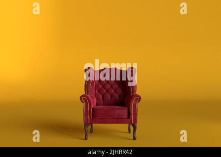Roter Samtsessel mit altem Design auf kurzen Beinen mit hohem Rücken isoliert auf goldenem Hintergrund. 3D Rendern Stockfoto
