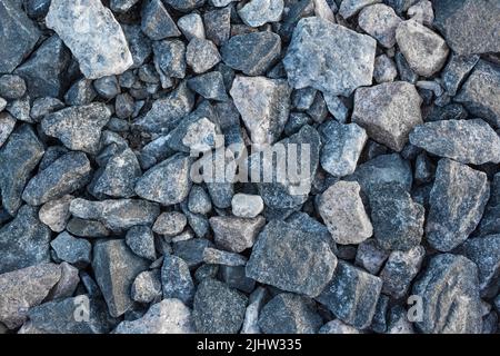 Rubble Hard Industrial Stone Material Textur Hintergrund Abstrakt Blaues Muster. Stockfoto