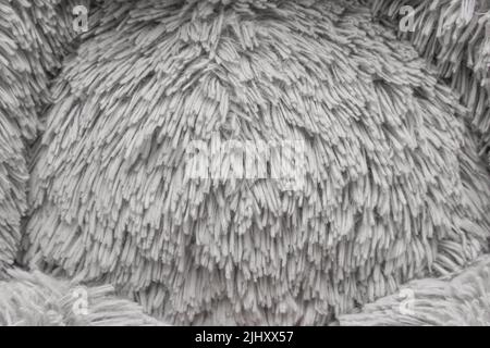 Puffy Stoff Textur weichen Spielzeug grau helle Farbe abstraktes Material Muster Textil Nahaufnahme Hintergrund. Stockfoto