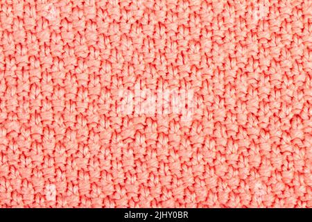 Rosa Gestrickter Stoffhintergrund oder Textur Stockfoto