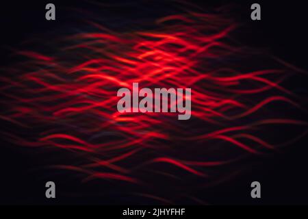 Abstrakter Hintergrund von roten Wellen in Bewegung Stockfoto