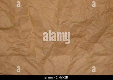 Zerknittertes Pergamentpapier. Hintergrund aus altem Papier. Backpapier. Stockfoto