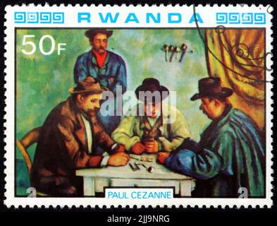 RUANDA - UM 1980: Eine in Ruanda gedruckte Briefmarke zeigt die Kartenspieler, Gemälde von Paul Cezanne, französischer Maler, um 1980 Stockfoto