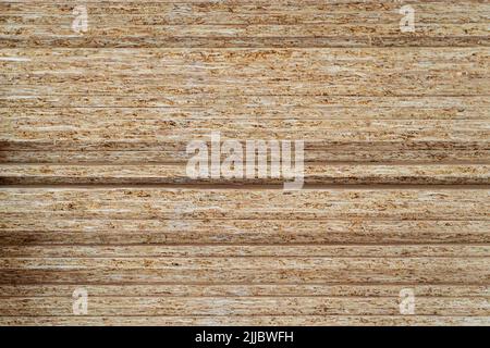 Stapel von OSB-Sperrholzplatten aus komprimierter Sägemehl-Textur. Stockfoto