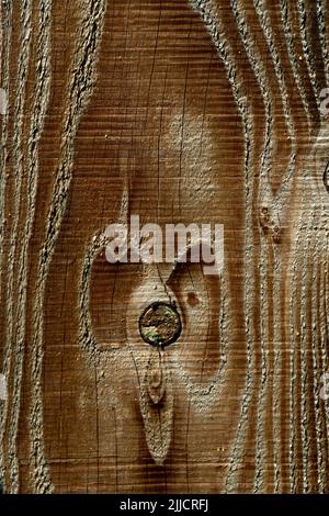 Nahaufnahme der strukturierten Holzoberfläche mit natürlichen Mustern und Korndetails Stockfoto
