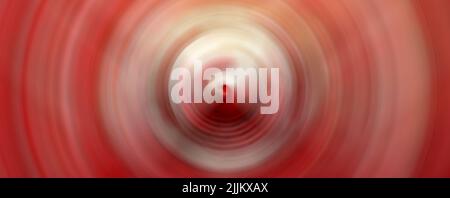 Ein abstrakter Hintergrund konzentrischer Kreise. Psychedelischer Weltraum Hintergrund. Rote Farben Stockfoto