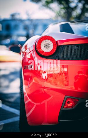 A vertical close-up of a red Ferrari car taillight Stockfoto