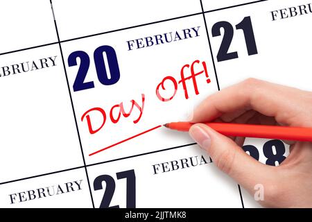 20. Tage im Februar. Schreiben Sie Text FREI UND zeichnen Sie eine Zeile am Kalenderdatum 20. Februar. Urlaubsplanungskonzept. Wintermonat, Tag des y Stockfoto