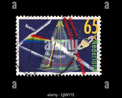 Prisma spaltet das Licht, wie es der berühmte Wissenschaftler, Forscher, Mathematiker, Astronom, Beobachter Isaac Newton (1642-1727), der Planet Saturn als obse entdeckt hat Stockfoto