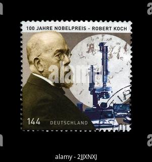 Robert Koch (1843-1910), Entdecker Prävention von Tuberkelbazillen, Nobelpreis für Medizin, um 2005. Stempel gedruckt in Deutschland isoliert auf Schwarz Stockfoto