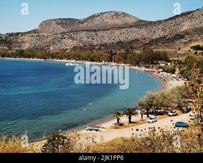 GRIECHENLAND EIN WEITERER HEISSER TAG - MENSCHEN AM STRAND Stockfoto