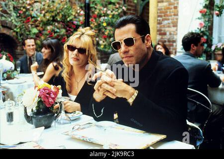 Rene Russo & John Travolta Film: Get Shorty (1995) Charaktere: Karen Flores & Chili Palmer Regie: Barry Sonnenfeld 20. Oktober 1995 **WARNUNG** Dieses Foto ist nur für redaktionelle Zwecke bestimmt und unterliegt dem Copyright von MGM und/oder dem von der Film- oder Produktionsfirma beauftragten Fotografen und kann nur durch Publikationen im Zusammenhang mit der Bewerbung des oben genannten Films reproduziert werden. Eine obligatorische Gutschrift an MGM ist erforderlich. Der Fotograf sollte auch bei Bekanntwerden des Fotos gutgeschrieben werden. Ohne schriftliche Genehmigung der Film Company kann keine kommerzielle Nutzung gewährt werden. Stockfoto