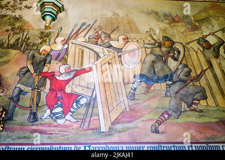 Detail einer der großen Wandmalereien, die eine gewalttätige Kampfszene mit Bogenschützen und Kettenpost darstellen. Im Cardiff Castle in Cardiff, Wales, United King Stockfoto