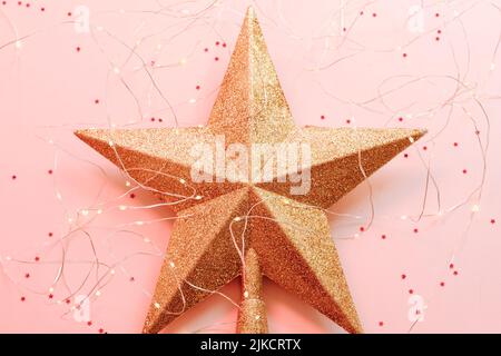 weihnachten Grußkarte goldenen Stern Ornament rosa Stockfoto