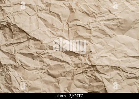 Beige zerknittert Papier gefaltet Textur Hintergrund Stockfoto