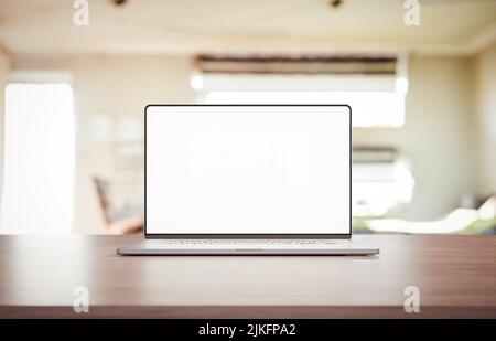 Laptop mit einem leeren rahmenlosen Bildschirm auf dem Tisch - 3D Render Stockfoto