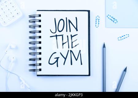 Inspiration Vorzeibeschild Join the Gym. Konzeptionelle Foto-Motivation, um mit dem Training beginnen Making Exercises Fitness Notebook mit New Message on Desk Stockfoto