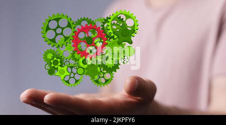 Ein 3D Design von Mechanismus grünen Zahnräder und Zahnräder bei der Arbeit auf schwarzem Hintergrund. Stockfoto