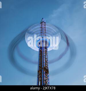 Leichte Spuren von der Fahrt mit dem Flugstuhl auf der St Giles Fair, Oxford. September 2014 Stockfoto