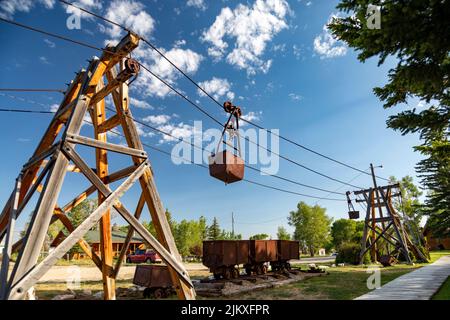 Encampment, Wyoming - das Grand Encampment Museum zeigt die Bergbau-, Viehzüchts- und Abholungsgeschichte der Stadt. Eine 16-Meilen-Seilbahn, die lange Stockfoto