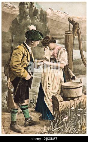 Paar in typisch bayerischer Kleidung. Alte deutsche Postkarte Stockfoto