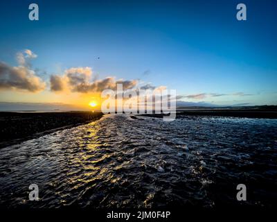 Herbstsonnenaufgang am Dunster Beach Stockfoto