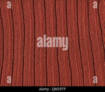 Stoff Kaffee farbige Textur für Hintergrund und Design. Braunfarbener abstrakt gewebter Strickmode im textilen Hintergrund. Stockfoto