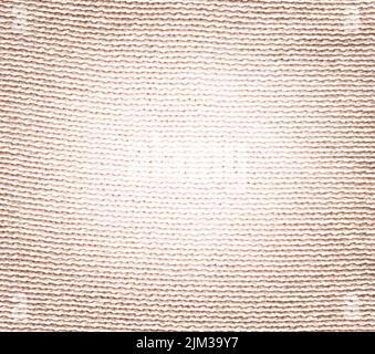 Gestrickte, cremefarbene, klare Winterstruktur. Wolle cremefarbene Pullover Textur Nahaufnahme. Stockfoto